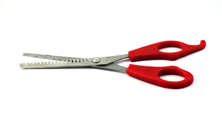 Red- handled scissors with close up Isolated on white backgroundの写真素材