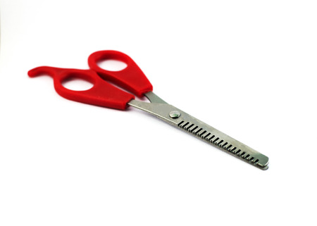Red- handled scissors Isolated on white backgroundの写真素材