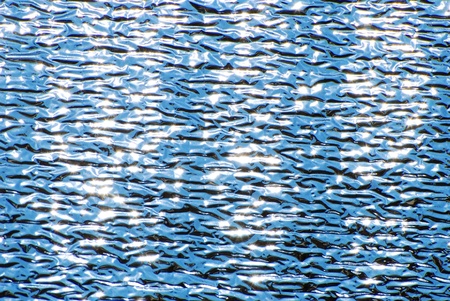This pattern is created from the sun shining on a car reflective sun shade.の写真素材