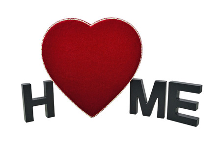 Fabric heart-shaped box and letters represent the saying, Home Is Where The Heart Is.の写真素材