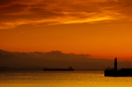A golden sunset over the bay of Gibraltar taken from Gibraltar looking towards Spain の写真素材