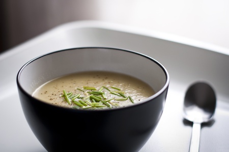 A close up photograph of a modern bowl containing Potato   Leek soup の写真素材