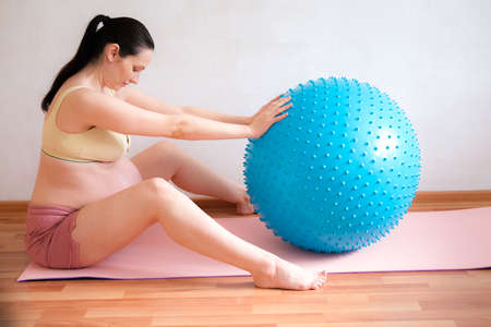 A pregnant woman goes in for sports. Healthy lifestyle conceptの写真素材
