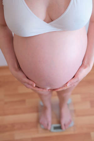 Pregnant womans belly close up. Overweight concept.の写真素材