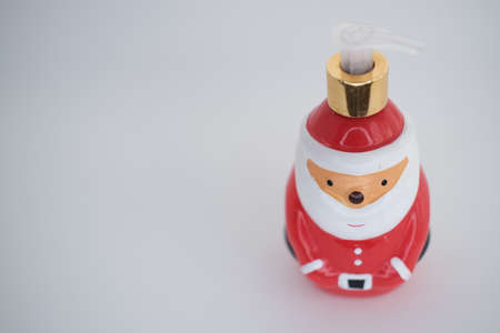 liquid antibacterial soap santa claus stands on the tableの写真素材
