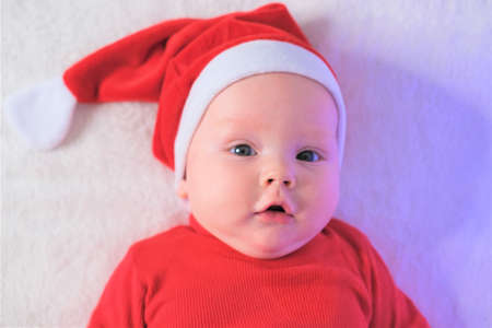 Christmas, winter, new year concept. Portrait of a handsome boy in a hat of Santa Claus
