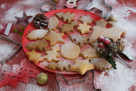 Christmas still life close up. Gingerbread cookies on a red background.Selective focusの写真素材