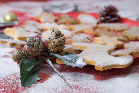 Tasty homemade Christmas cookies, closeup.Gingerbread cookies on a red background.Selective focus