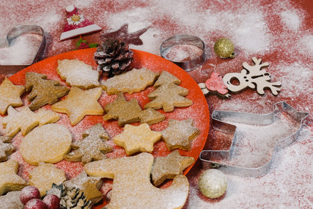 Tasty homemade Christmas cookies, closeup. Gingerbread cookies on a red background. Selective focus.の写真素材