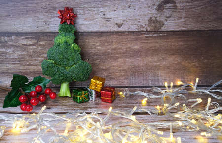 Christmas tree made from broccoli, on a wooden background, close-up, selective focus. 2022,2023.の写真素材