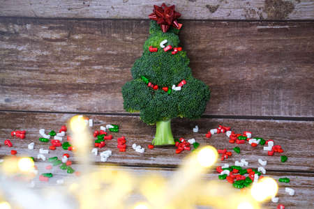 Christmas tree made from broccoli, on a wooden background, close-up, selective focus. 2022,2023.の写真素材