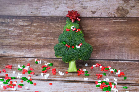 Christmas tree made from broccoli, on a wooden background, close-up, selective focus. 2022,2023.の写真素材