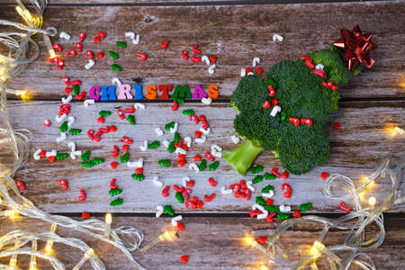Christmas tree made from broccoli, on a wooden background, close-up, selective focus. 2022,2023.の写真素材