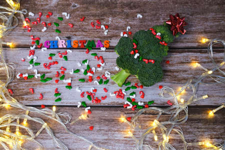 Christmas tree made from broccoli, on a wooden background, close-up, selective focus. 2022,2023.の写真素材
