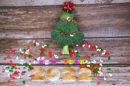 Christmas tree made from broccoli, on a wooden background, close-up, selective focus. 2022,2023.の写真素材