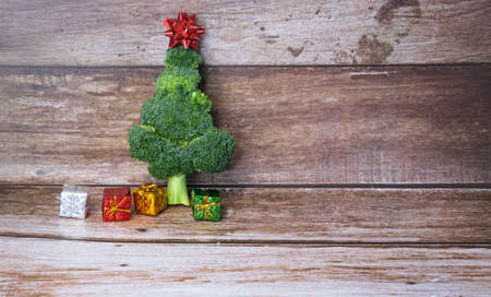 Christmas tree made from broccoli, on a wooden background, close-up, selective focus. 2022,2023.の写真素材