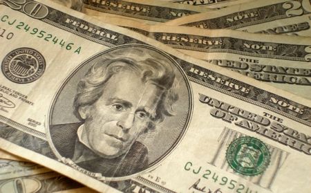 Background made of multiple $20 bills (US currency.)