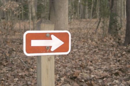 Sign at state campgrounds with an arrow pointing right.