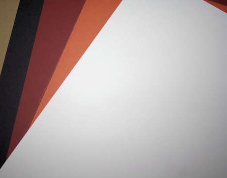 A variety of neutral color scrapbook paper ranging in color from black to white.の写真素材