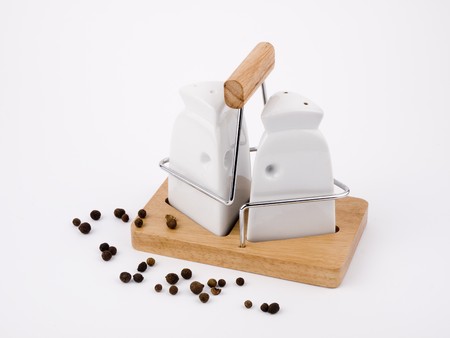 Salt cellar and pepperpot on white background.の写真素材
