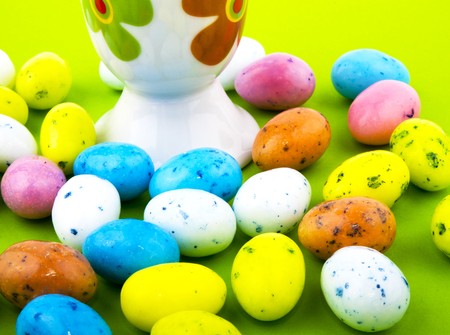 Lots of easter eggs on green background.の写真素材