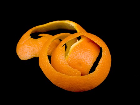 Orange peel on black backgroundの写真素材
