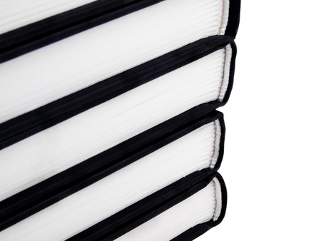 Closeup picture of spines of books on white backgroundの写真素材