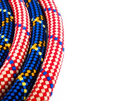 Closeup picture of climbing rope on white background. On the right side of picture it's empty white space.の写真素材