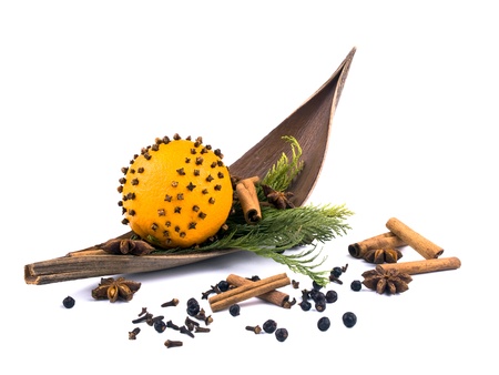 Christmas arrangement with thuja branches, orange and spices on white background.の写真素材