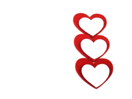 Picture of red and white valentine hearts made from felt on white backgroundの写真素材