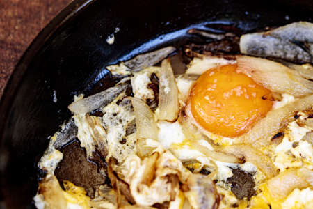 Pan fried eggs and chopped onions prepared in a light olive oil - great with crispy fresh bread.の写真素材