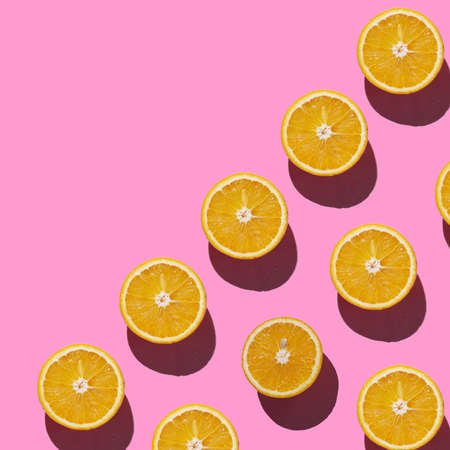 Cuted Half Orange on bright pink background pattern