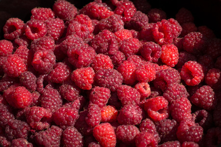 Bowl of red ripe raspberries