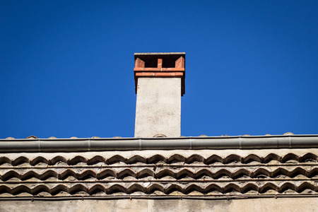 Traditional roof tiles and chimney from South of Franceの写真素材