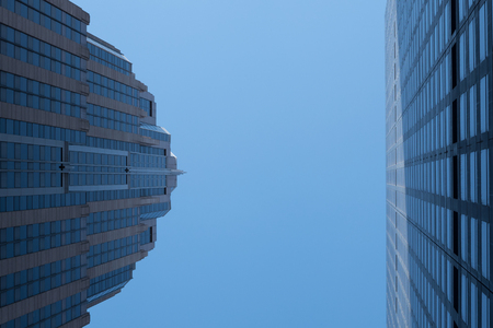 Two skyscrapers in Manhattan under blue skyの写真素材