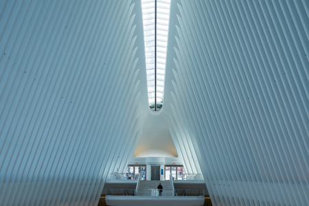 New York, USA - March 16th, 2017: A person stands inside the Oculus building in New York, USA.のeditorial素材