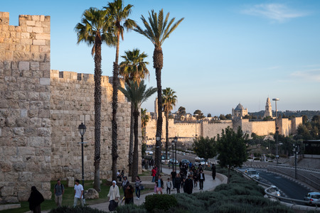 Jerusalem, Israel - March 17th, 2018: People walk the street in front of the New Gate, in the Old...