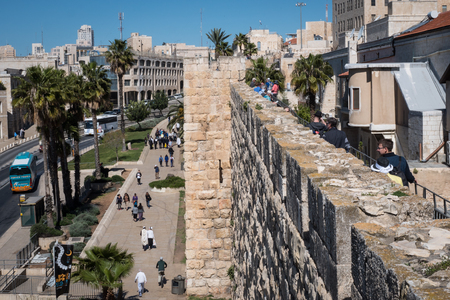 Jerusalem, Israel - March 17th, 2018: People walk the street in front of the Jaffa Gate, in the Old City of Jerusalem, Israel.のeditorial素材