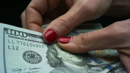 Successful woman checking amount of cash money, money payment concept. Closeup businesswoman hands...