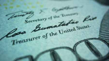 Detailed view new american dollar money. Closeup paper banknote of US currency. New type of american dollars cash money. Macro shot symbols on one hundred dollar banknote.の写真素材