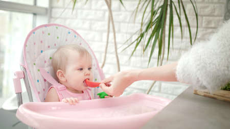 Little baby tasting red pepper.