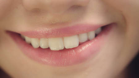 Smiling female mouth with ideal white teeth. Close up of smiling woman face with perfect smile. White teeth smile conceptの写真素材