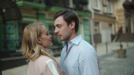 Close up handsome couple smiling at romantic date at city street. Successful business couple...