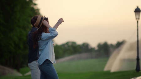 Closeup happy couple enjoy spending time together during walk outdoors. Playful man and woman...