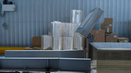 Production manufacture weight scales at industrial warehouse product boxes. Technological weighting...