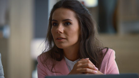 Happy businesswoman talking corporate meeting in financial company office. Young female executive...