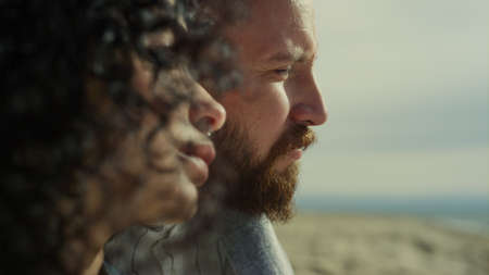 Couple face looking calm on relax sea beach. Close up mixed race people close eyes on nature....