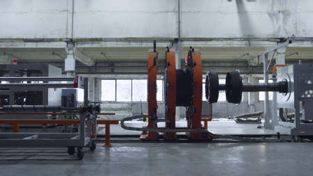 Factory tyre production machine in technological modern workshop facility. Process of rubber car...