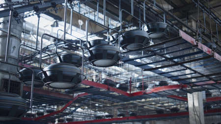 Tyre workshop conveyor line moving production in industrial automotive factory. Modern automated...