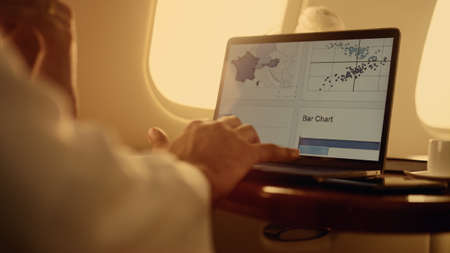 Manager hands working graphs on laptop computer closeup. Man using touchpad analyzing company...